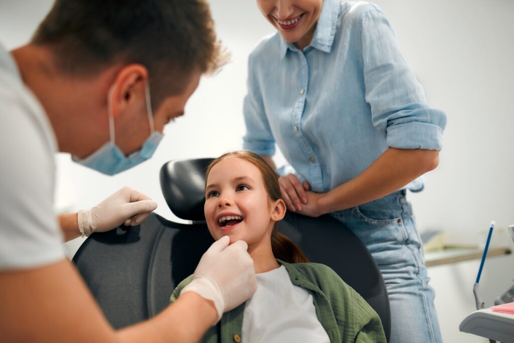 Girl getting dentist treatment